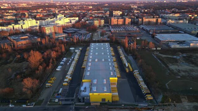 Long yellow DHL distribution center Berlin. Best aerial view flight drone