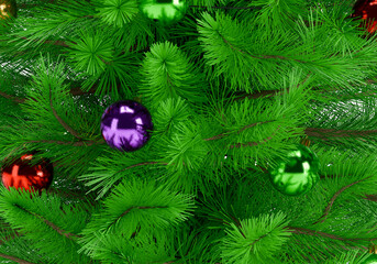 Close up of a perfectly decorated Christmas tree with balls on a white background
