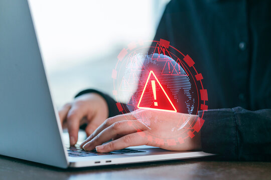 Cybersecurity alert during online work at home office with laptop and globe hologram graphic - Powered by Adobe