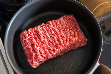 Preparing Fresh Minced Meat in a Frying Pan