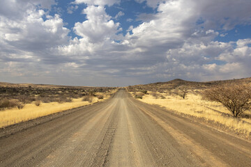 breathtaking landscape with empty gravel road in wild of hardap region in namibia