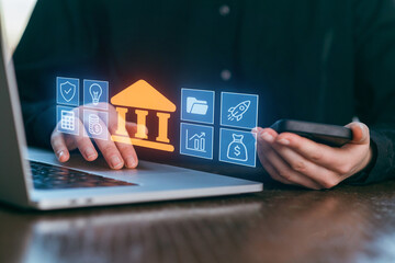 Exploring digital banking innovations with a laptop and smartphone in a modern workspace