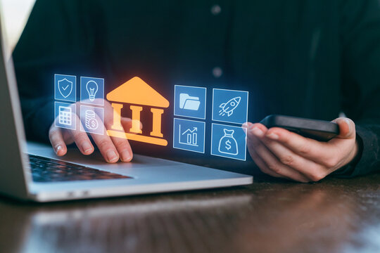 Exploring digital banking innovations with a laptop and smartphone in a modern workspace