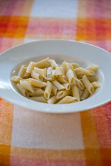 Plain Boiled Penne Pasta Served in White Bowl