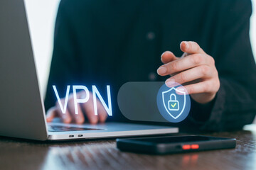 Using a VPN for secure internet browsing while working on a laptop in a modern workspace