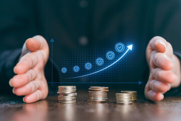 Hands protecting coins with a digital growth chart rising, symbolizing financial success and security