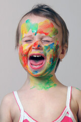 Pure childhood happiness expressed through bright splashes of paint.