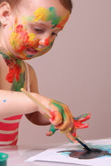 A child discovering art as a safe space for imagination and freedom.