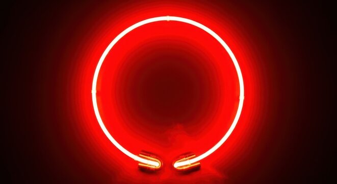 Bright red glowing neon circle light tube on abstract background