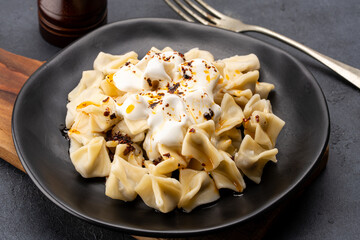 Traditional Turkish dish manti. Traditional dish made with handmade dough and minced meat.