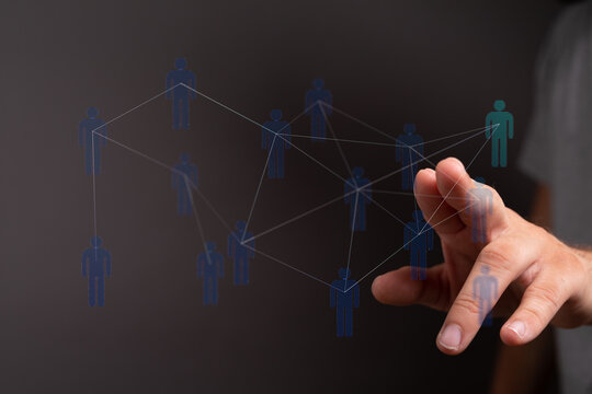 Hand touching digital interface, representing concept of connection, technology, networking, and social media.