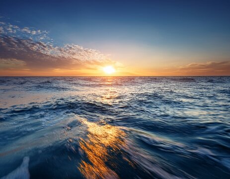 tranquil ocean sunrise with endless horizon and gentle waves