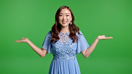 Excited Asian Woman in Blue Dress Gesturing Surprise on Green Screen A Vibrant Studio Shot for Chroma Key Compositing and Engaging Content Creation.