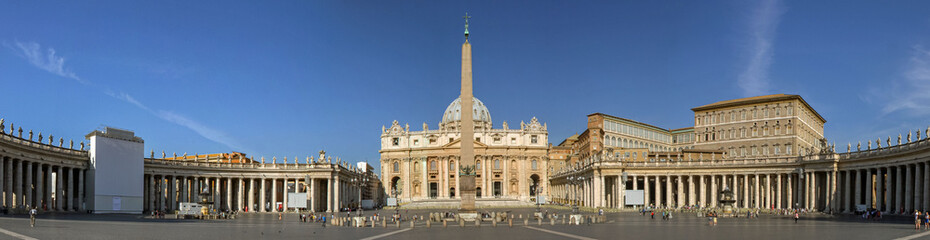 A panoramic view of St. Peter's Basilica and the historic architecture of the Vatican in Rome,...