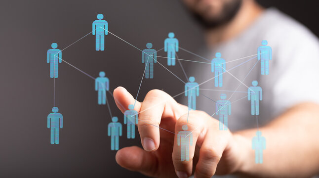 Close-up of a man's finger interacting with a digital network representing connections and teamwork. Concept of - Powered by Adobe