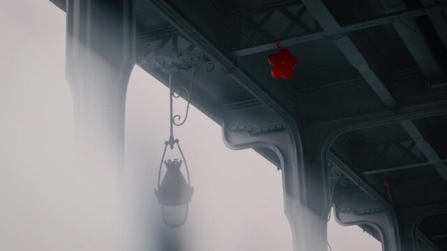 Enigmatic view of a Red Balloon in the steel environment of the Bir Hakeim bridge