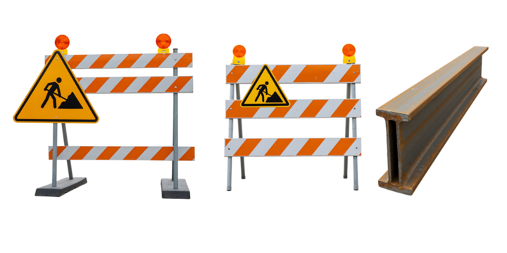 Construction barriers and warning sign on black background