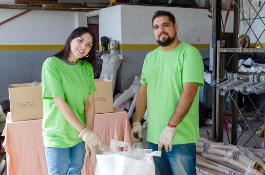 Portrait of two smiling and happy volunteers cleaning.Recycle concept.Earth Day concept.