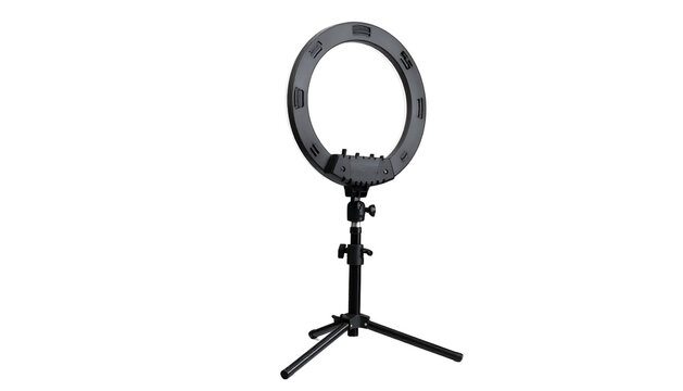 Black ring light on a tripod, centered against a dark backdrop - Powered by Adobe