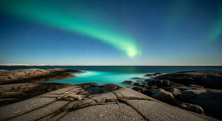 Bright Green Aurora Arc Over a Rocky Shoreline with Turquoise Glowing Water