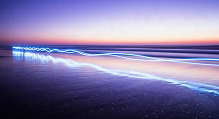 Blue Light Trails Tracing Wavy and Straight Lines on a Twilight Beach Shore