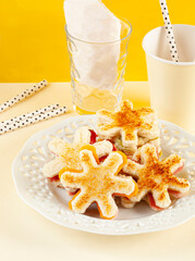 Star-shaped ham and cheese sandwich. Snack for children.