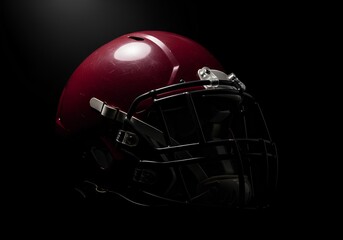 Dark monochromatic image of a football helmet, prominently showcasing a maroon color with contrasting black background