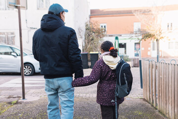 Father and daughter walking hand in hand on a city street, going to school, symbolizing family bonding, care, safety, and guidance in urban setting