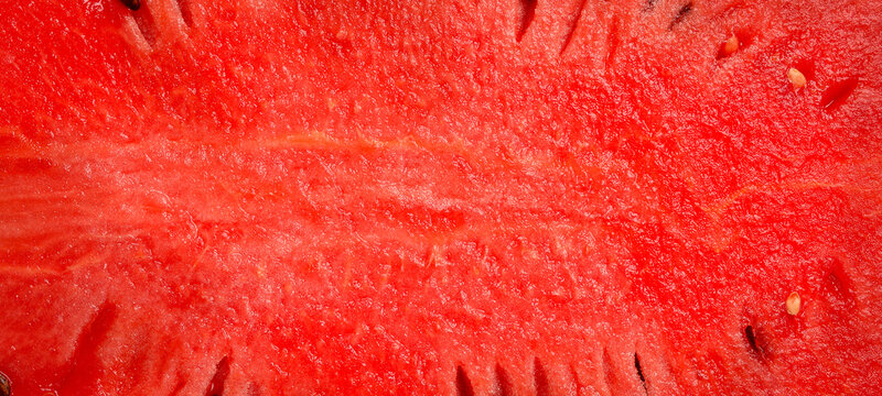 Watermelon texture, macro photo, close-up. Piece of watermelon with seeds. Top view.