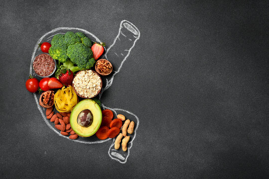 Healthy diet for human stomach: oatmeal, flax, banana, green broccoli, fresh avocado and other healthy vegetables and fruits. Healthy food clean eating selection.
