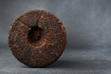 Chinese black tea Pu-erh. Traditional aged pressed tea.