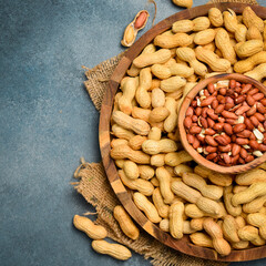 Wooden bowl with peanuts in the shell. Nuts Close-up.