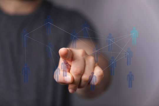 Hand touching digital interface representing human connections, social media, networking, global business, team - Powered by Adobe