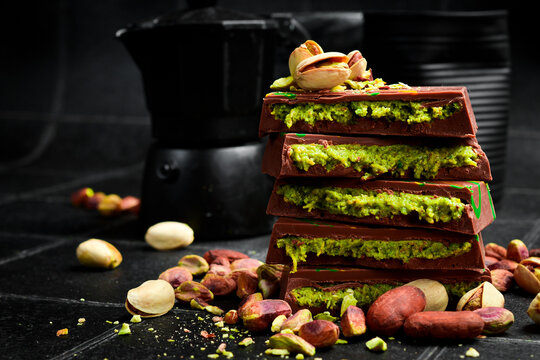 Pistachio Kunafa Chocolate Bar. Dubai Chocolate with pistachio nuts. Side view.