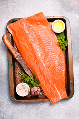 Half of fresh raw salmon fillet ready to cook. Top view.