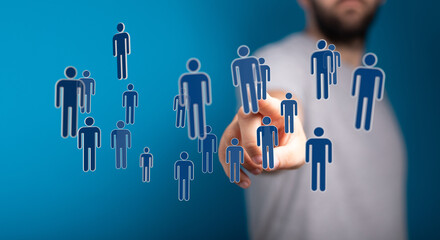 Digitally generated figures representing people with a human hand pointing towards them. Concept of social netw