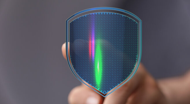 Hand holding a futuristic digital shield, representing data protection, cybersecurity, and secure network infrastructure. Illustratio