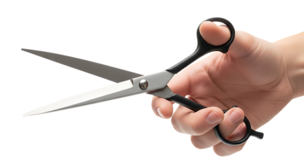 Hand holding open scissors isolated on transparent background for cutting or trimming