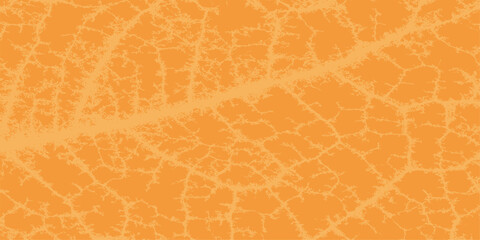 Abstract orange leaf texture pattern with a rough vintage grunge paper surface closeup