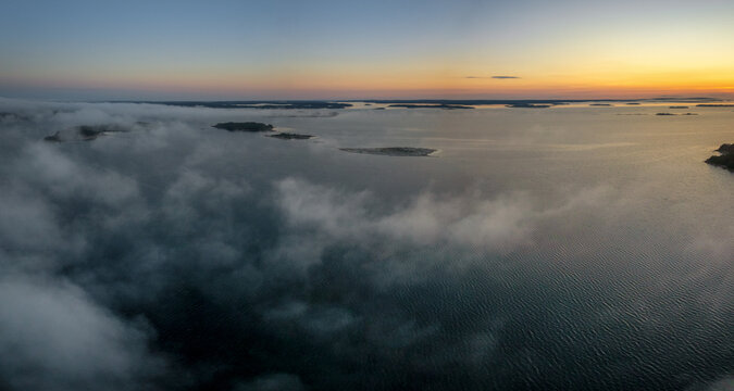 aerial panorama view of a beautiful sunset over the skerries and islands of the Aland archipelago in the Baltic Sea - Powered by Adobe