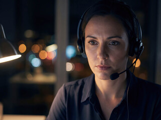 Helpline operator woman with headset working late night crisis support call center mental health suicide prevention consulting depression emergency service volunteer empathy dark office background