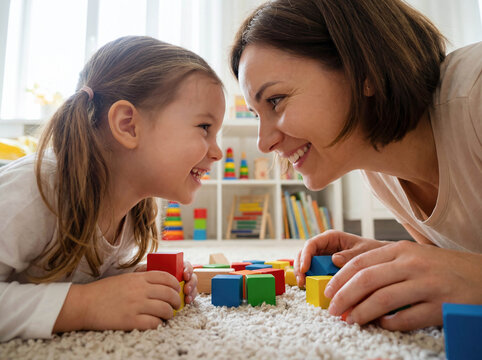 Child psychologist playing with little girl blocks floor play therapy mental health development support education guidance professional doctor kindness happy kid toy psychology