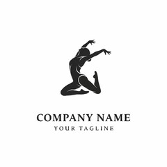 Graceful female dancer in mid-air leap, showcasing elegant movement and athletic form.