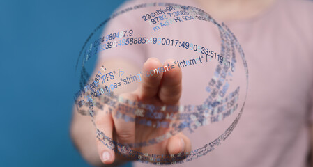 Abstract image of a hand touching a digital globe with code overlaid. Represents data, technology, innovation, and connection. Perfec