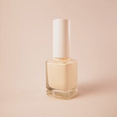 Light yellow nail polish bottle on soft background