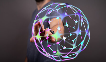 A close-up of a human hand touching a glowing network sphere representing global connection, information, and technology. Ideal for c