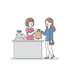 Fototapeta premium Customer receiving shopping bag from cashier at retail store checkout - commerce and customer service