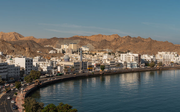 View of Mutrah Corniche with seaside promenade and rocky hills in Muscat
