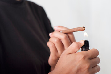 Fototapeta premium Lighting Tobacco Stick with Flame