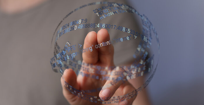 Close up of a hand interacting with a sphere of digital code, symbolizing connection, innovation, and technological advancement. Idea - Powered by Adobe